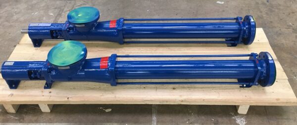 Two blue Fludyn BEH 1500 progressing cavity pumps / mono pumps, without motor, bolted crosswise on a wooden pallet