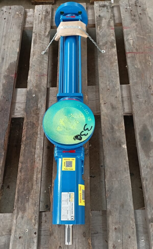 A blue Fludyn BEH 236 progressing cavity pump, without motor, screwed onto a somewhat old wooden pallet