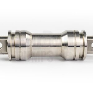A coupling rod for Bornemann E4H 164 progressing cavity pumps made of metal. The picture has a neutral white background. The coupling rod lies crosswise and you can see the connections for the two joints on the sides.